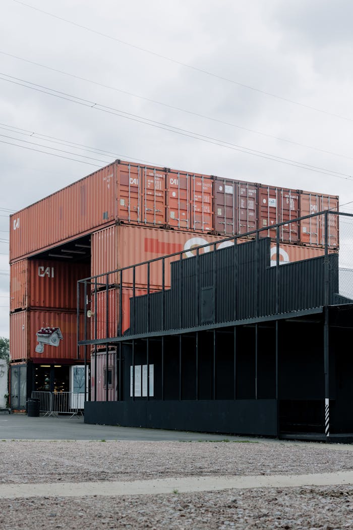 Urban scene with stacked shipping containers used for storage and operations.
